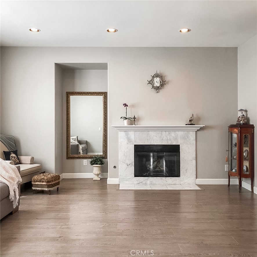 18 Avalon, Unit 5 Irvine, CA 92602 - Photo 5 of 6 a living room with furniture and a fireplace