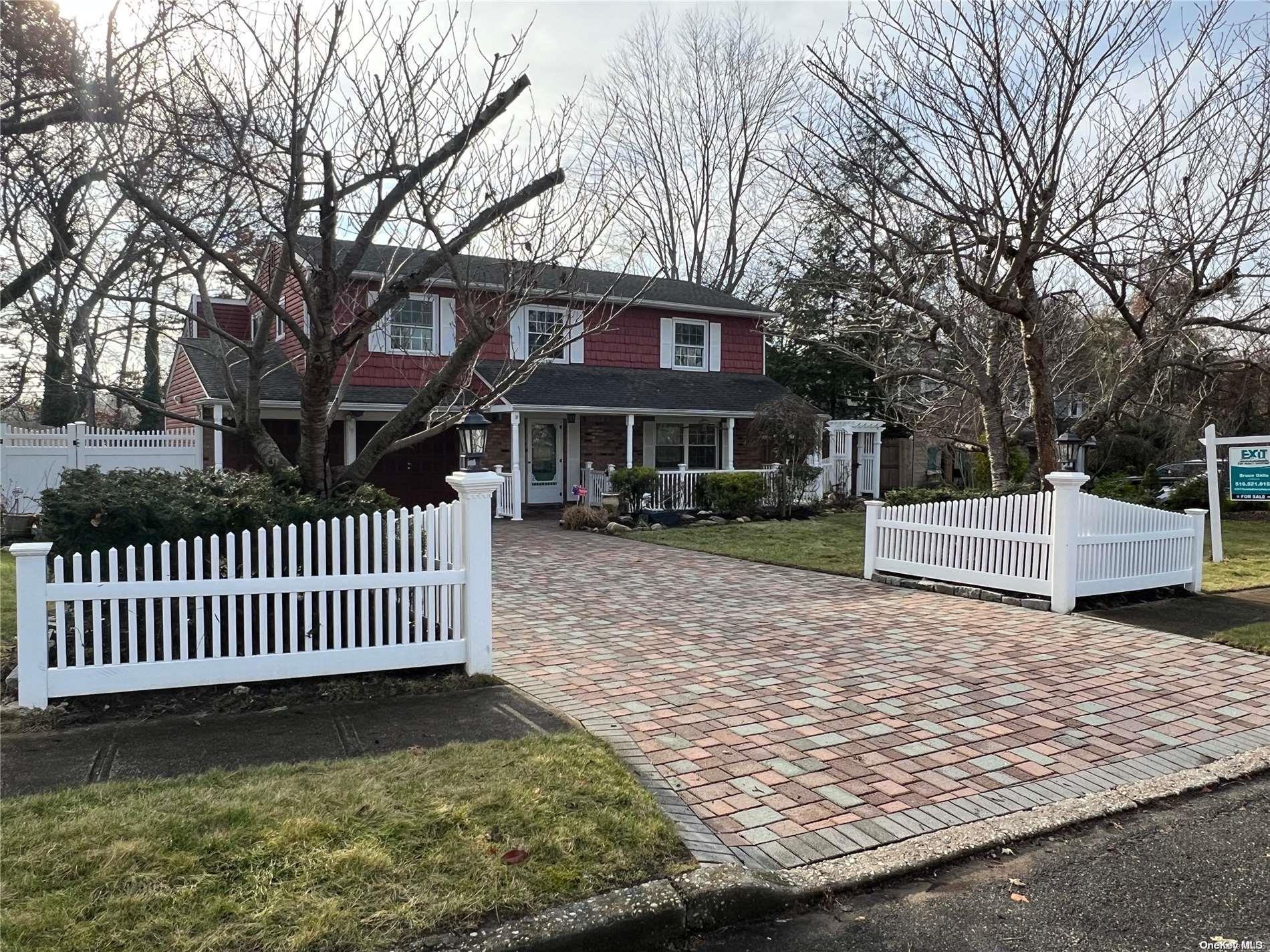 18 Roy Drive Nesconset, NY 11767 - Photo 1 of 1 a front view of a house with garden