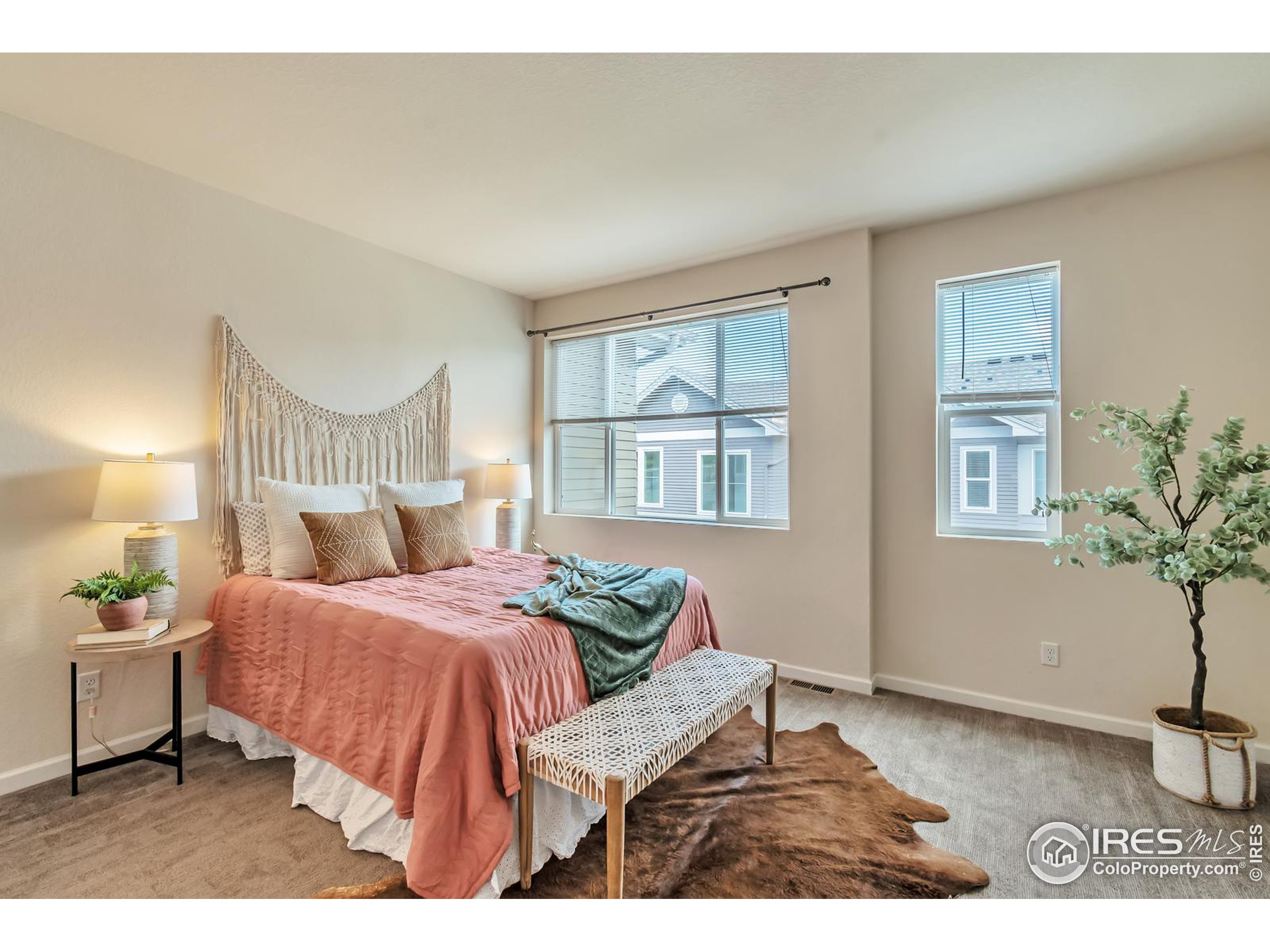 15546 West 64th Loop, Unit C Arvada, CO 80007 - Photo 14 of 27 a bedroom with a bed and window