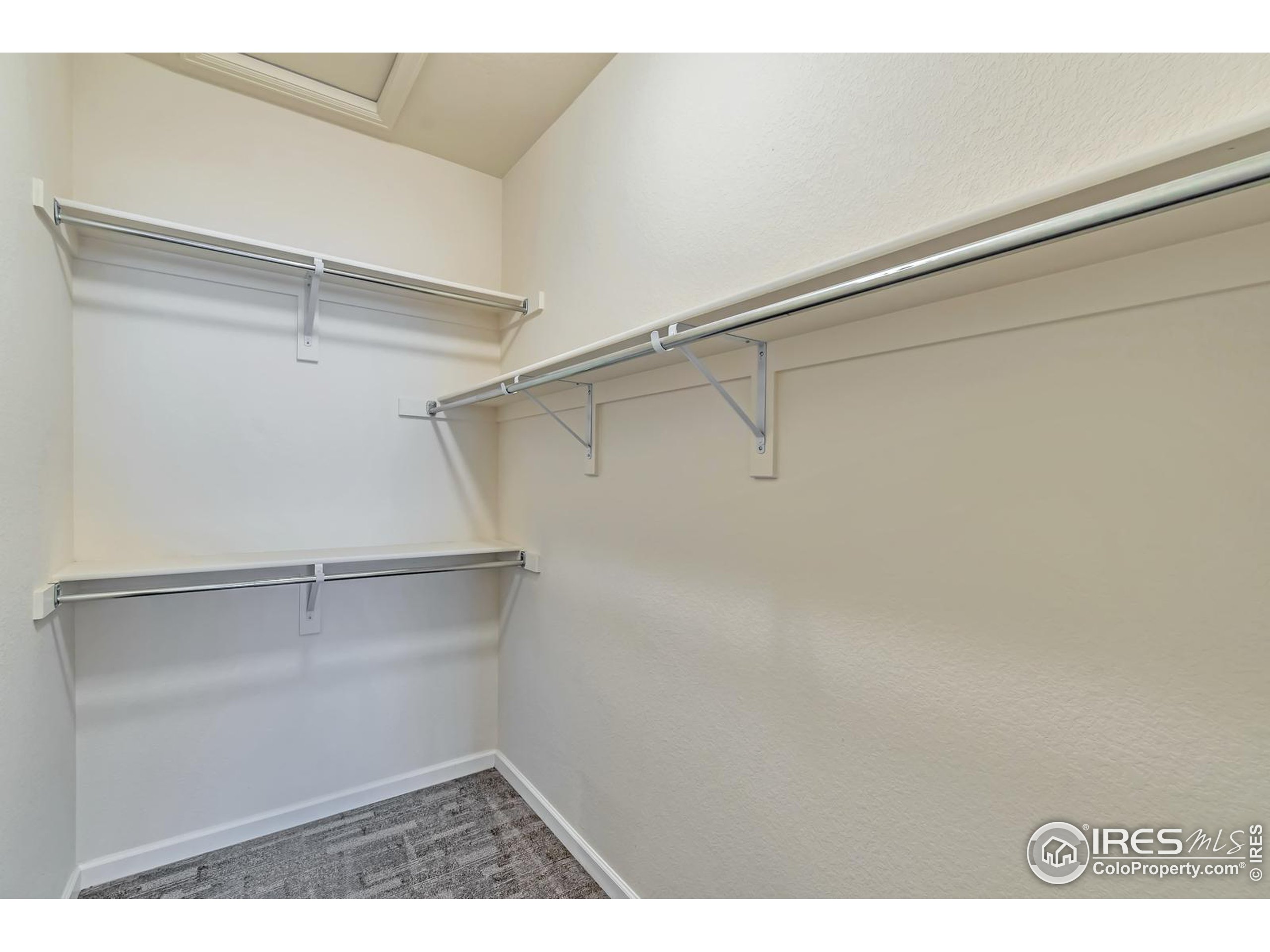 15546 West 64th Loop, Unit C Arvada, CO 80007 - Photo 17 of 27 a view of an empty walk in closet