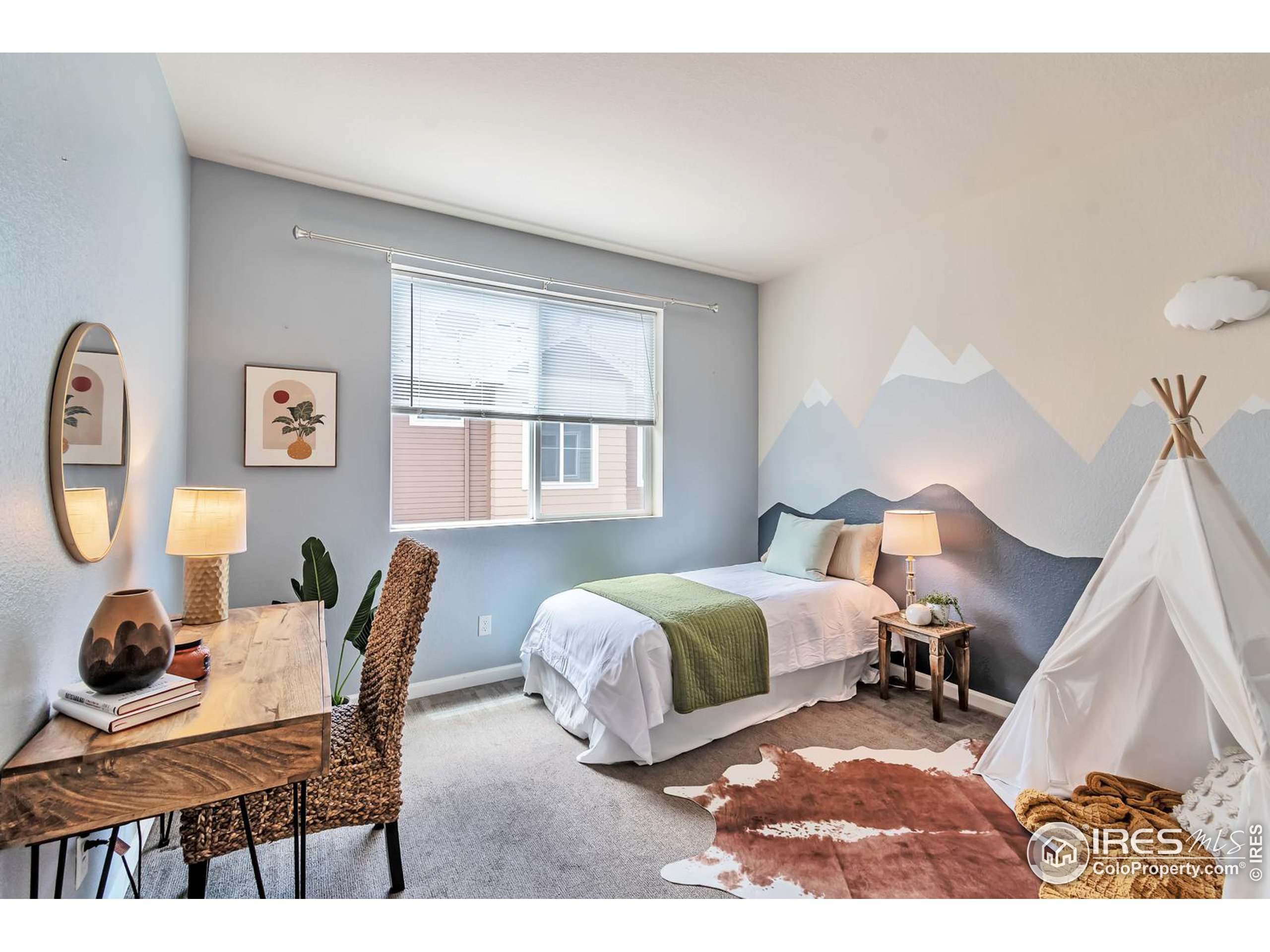 15546 West 64th Loop, Unit C Arvada, CO 80007 - Photo 18 of 27 a bedroom with furniture and a window