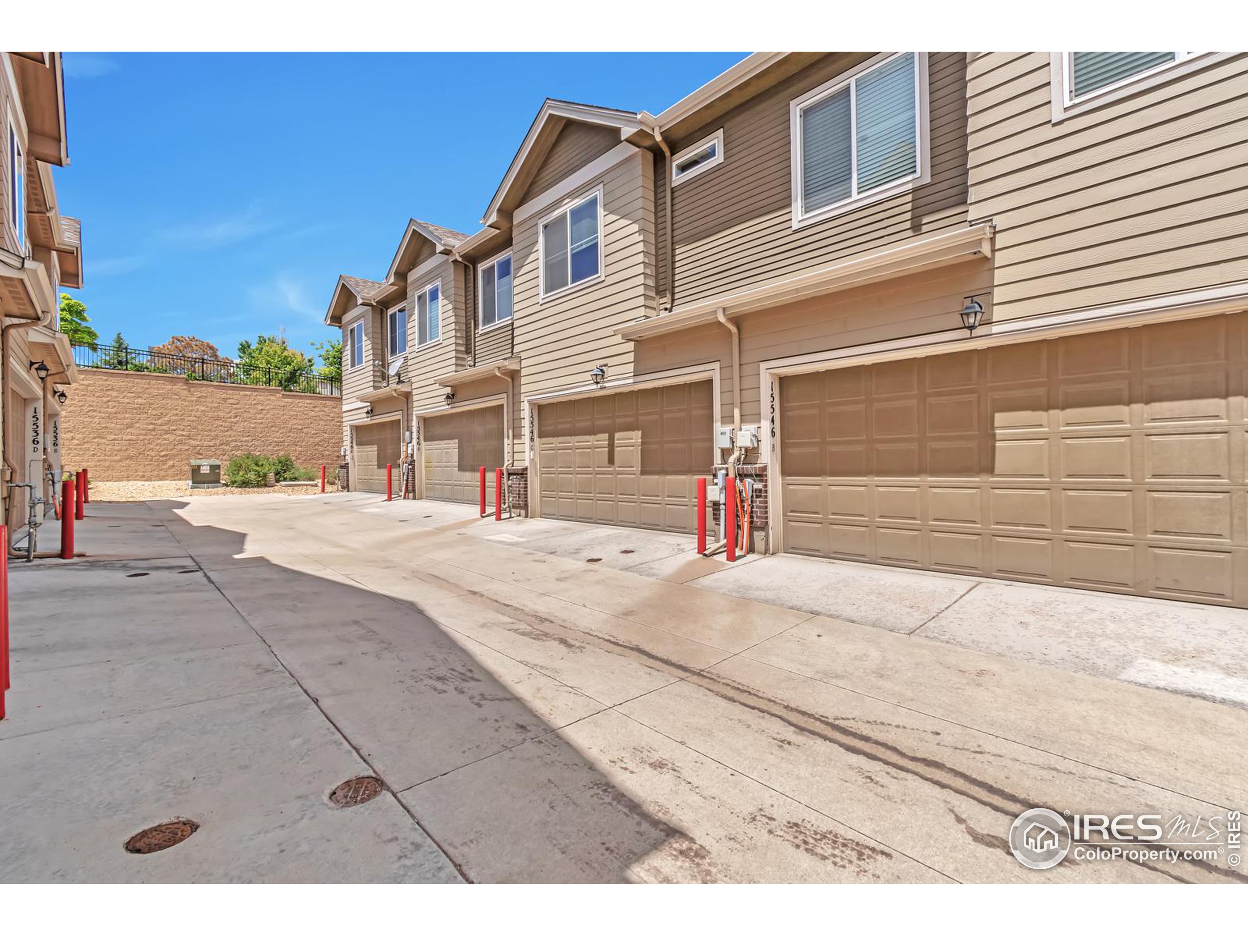 15546 West 64th Loop, Unit C Arvada, CO 80007 - Photo 22 of 27 a view of a house with a street