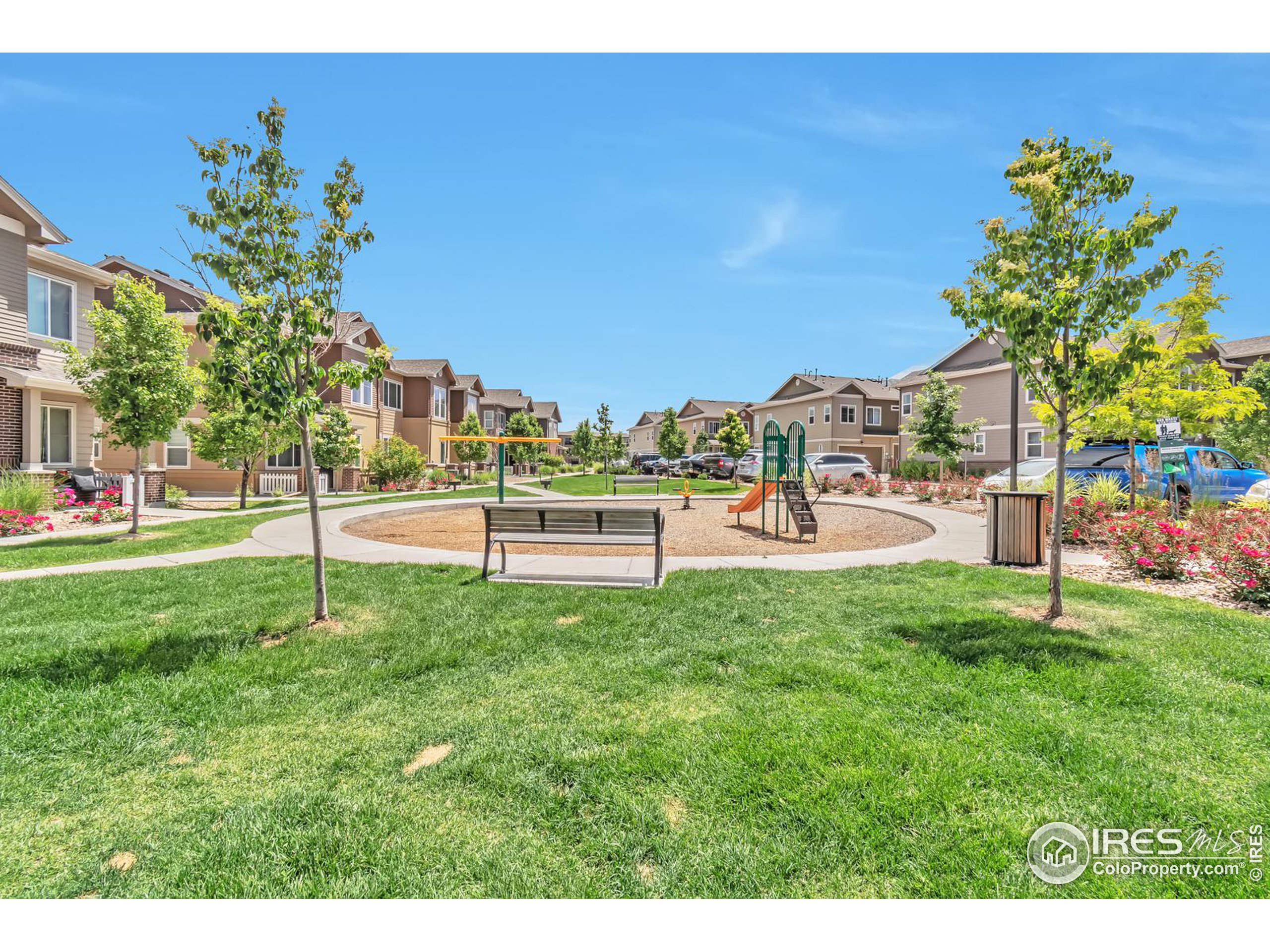 15546 West 64th Loop, Unit C Arvada, CO 80007 - Photo 24 of 27 a green field with lots of trees in the background