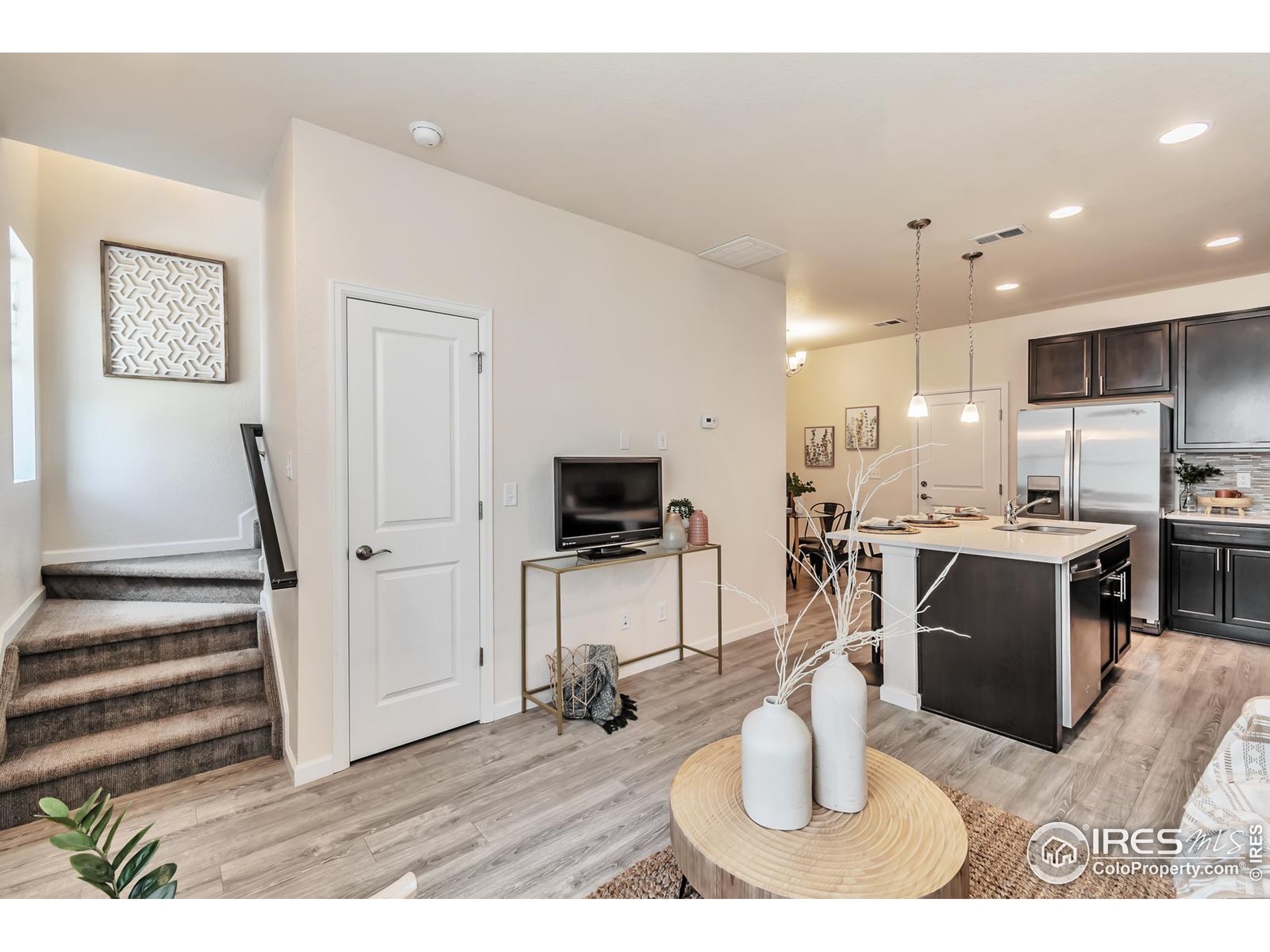 15546 West 64th Loop, Unit C Arvada, CO 80007 - Photo 6 of 27 a kitchen with a sink appliances and cabinets