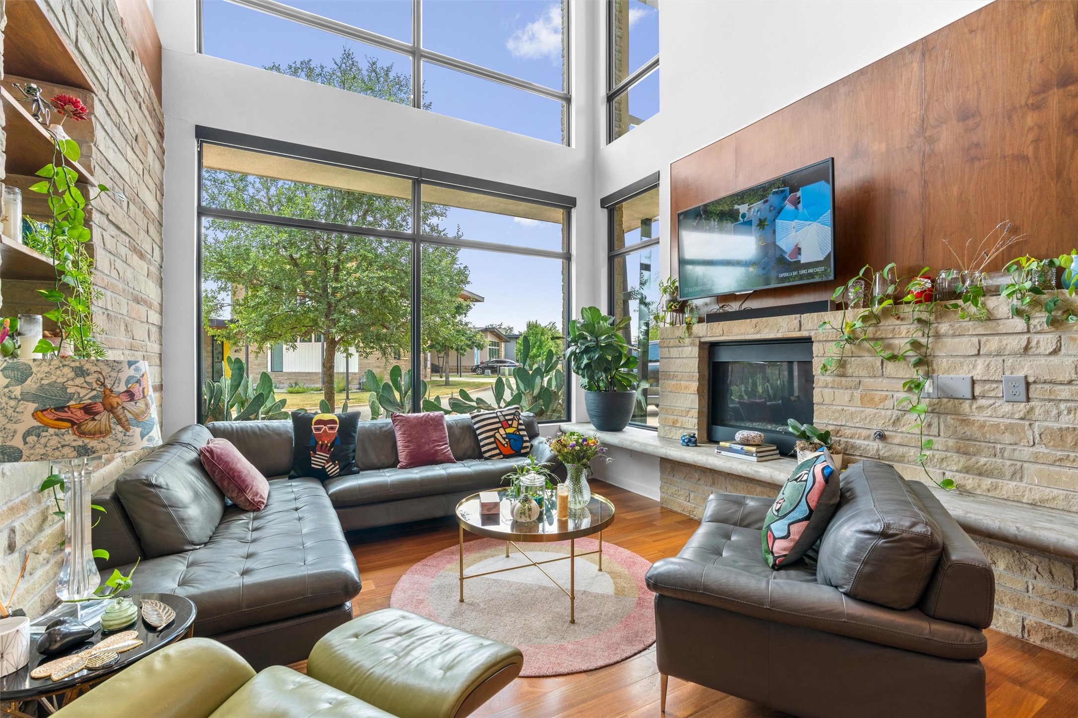 408 Starlight Village Loop Leander, TX 78641 - Photo 8 of 40 A spacious living room features soaring ceilings and abundant natural light from expansive windows.