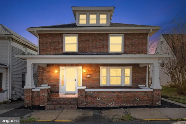 a view of a house with wooden floor and windows