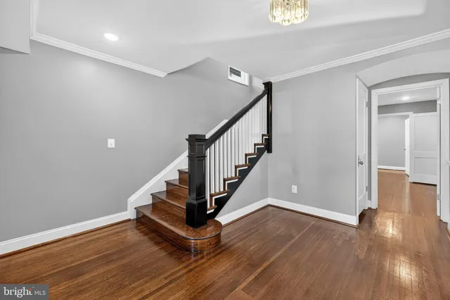 a kitchen with granite countertop a sink and refrigerator