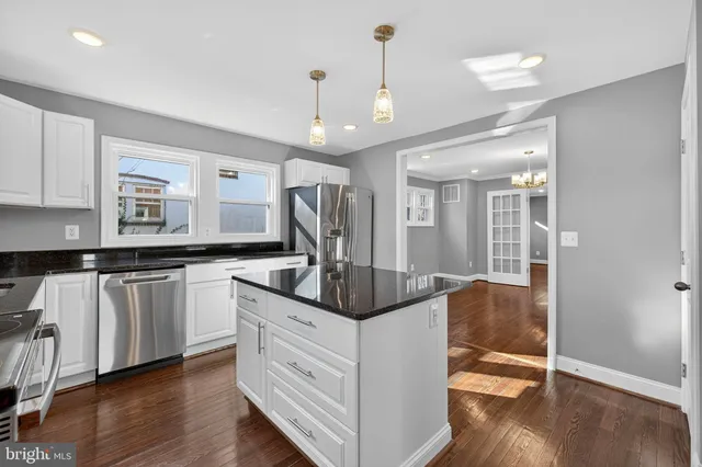 a view of entryway with stairs and wooden floor