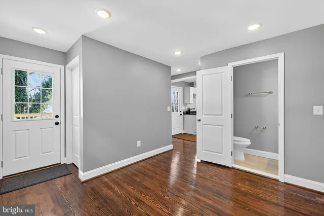 a bathroom with a double vanity sink mirror and bathtub