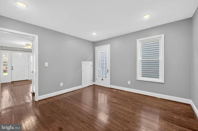a bathroom with a double vanity sink mirror and toilet