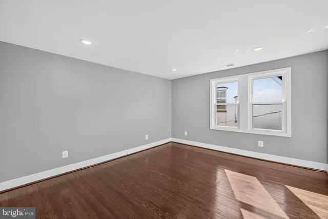 a view of empty room with wooden ceiling