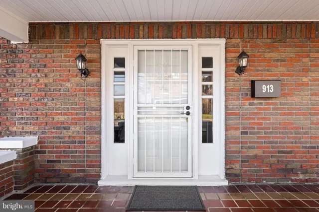 a view of empty room with wooden floor and fireplace