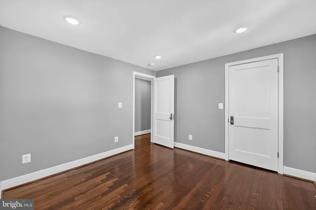 a large building with trees in the background