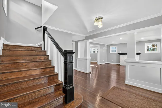a view of an entryway with wooden floor