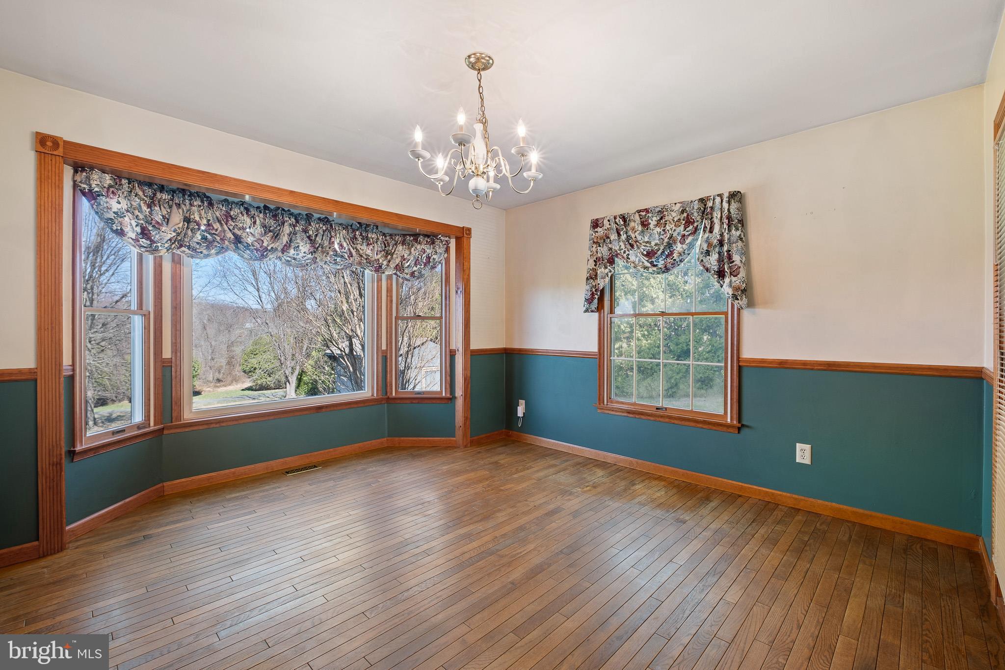 39 Long Drive Elkton, MD 21921 - Photo 12 of 39 a view of an empty room with wooden floor and a window