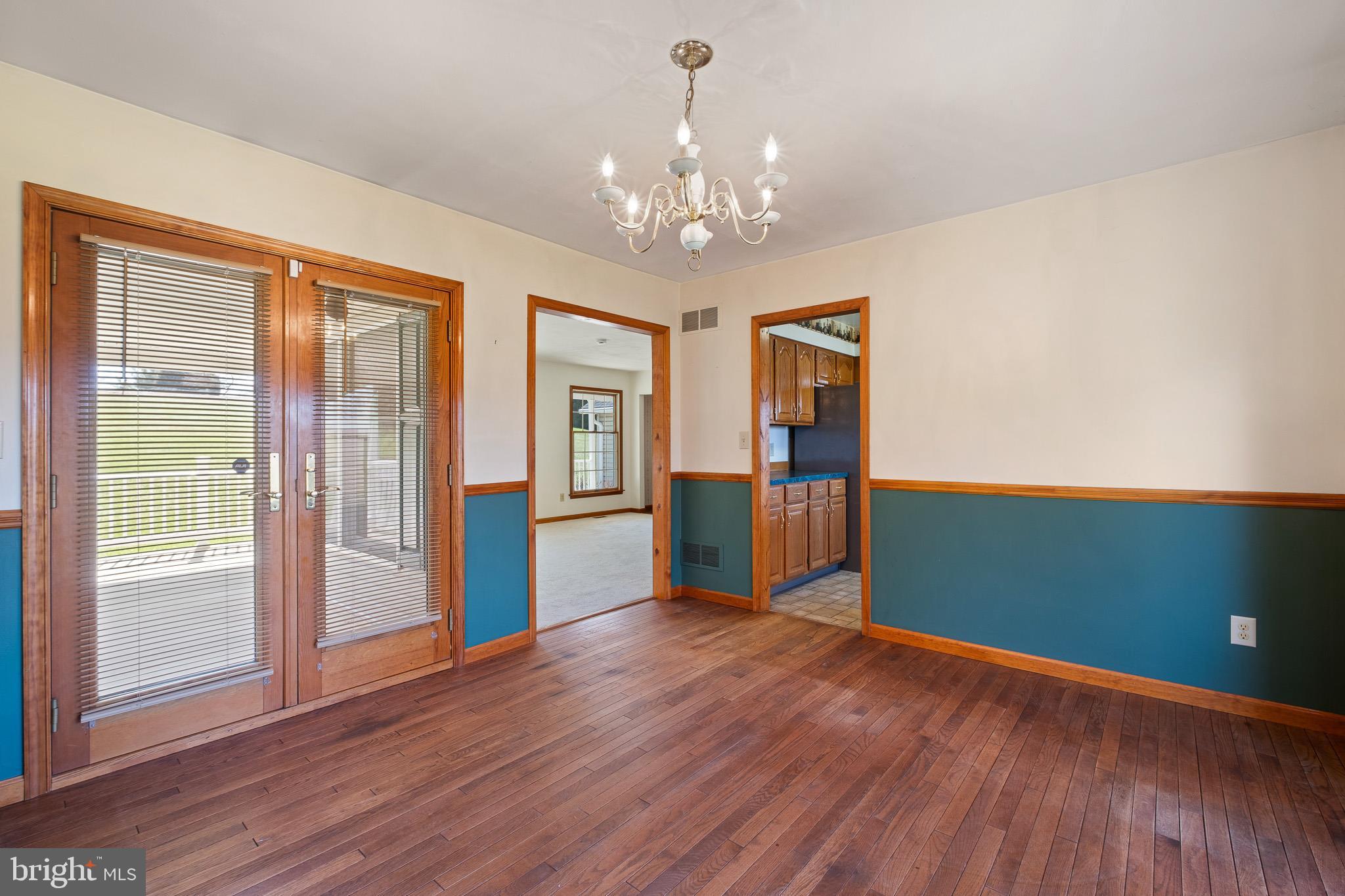39 Long Drive Elkton, MD 21921 - Photo 13 of 39 a view of an empty room with window and wooden floor