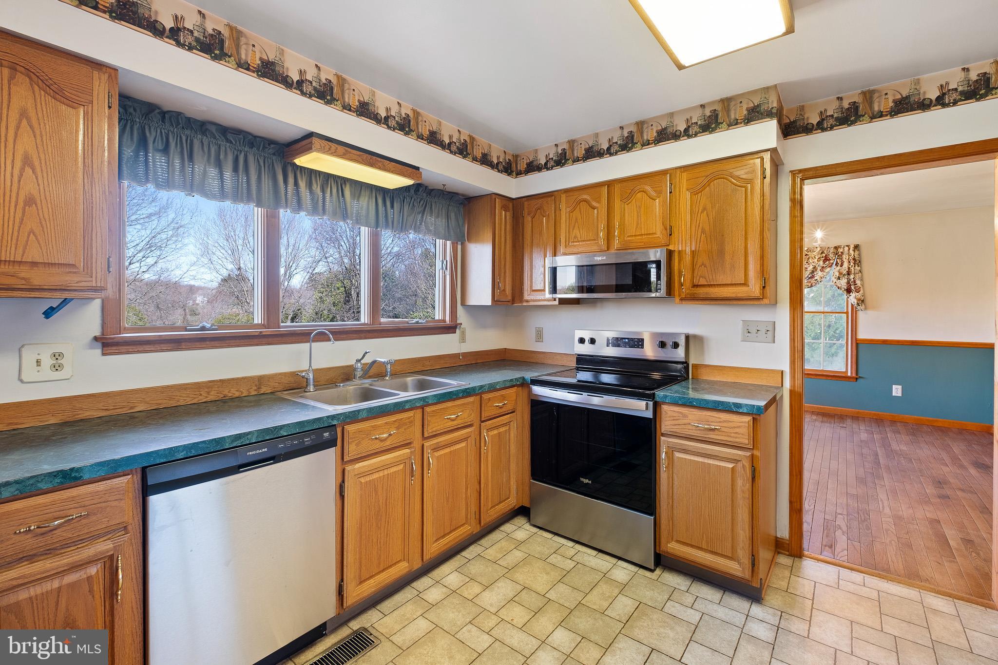 39 Long Drive Elkton, MD 21921 - Photo 14 of 39 a kitchen with stainless steel appliances granite countertop a sink and a stove