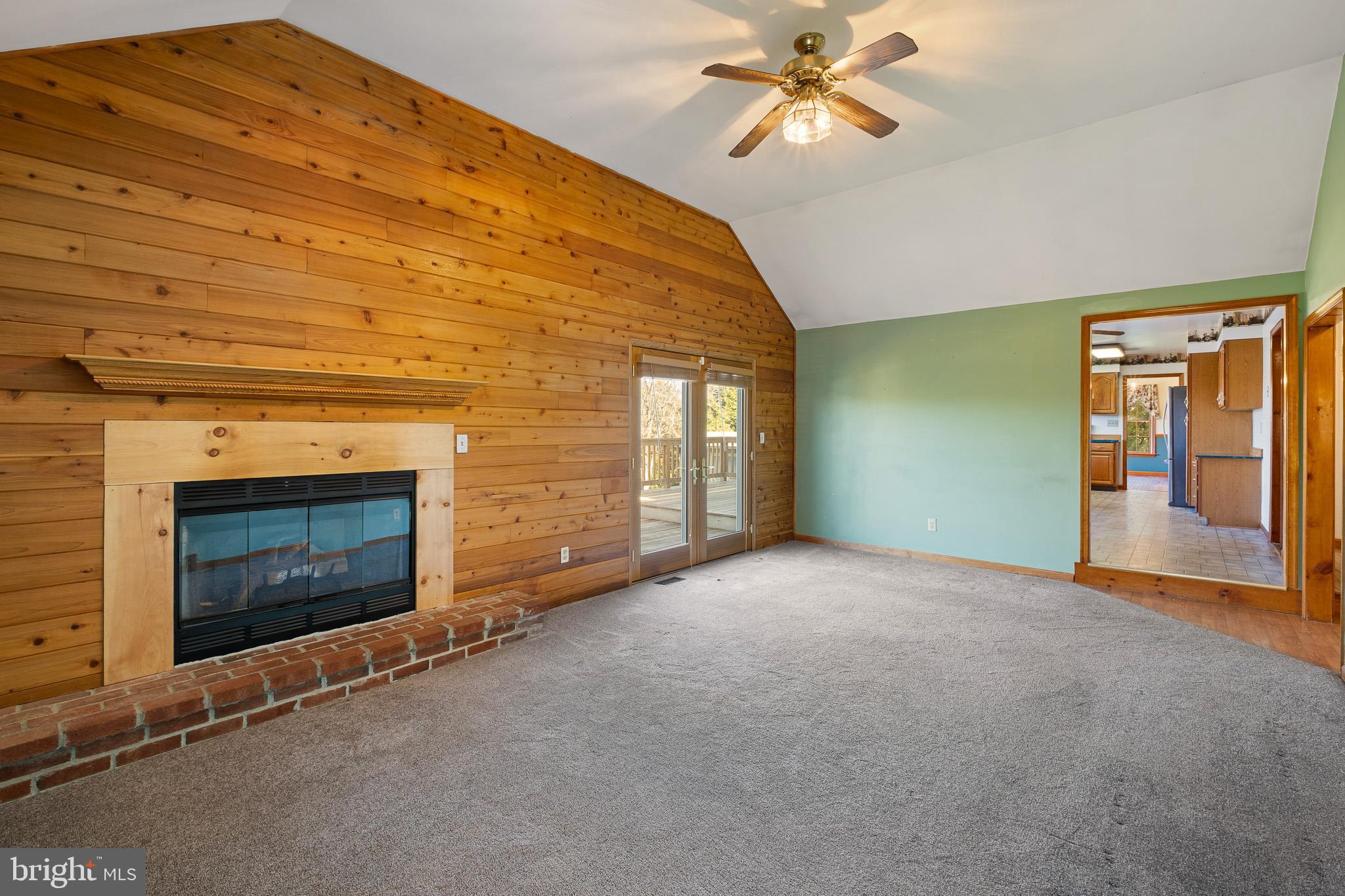 39 Long Drive Elkton, MD 21921 - Photo 19 of 39 a view of empty room with fireplace and fan