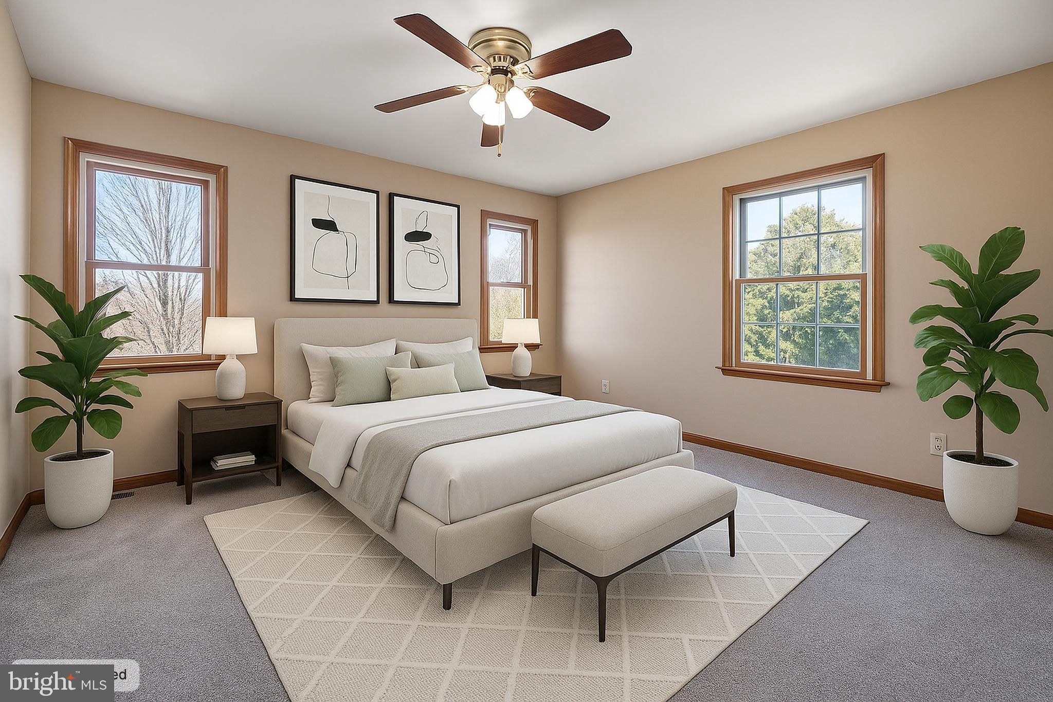 39 Long Drive Elkton, MD 21921 - Photo 25 of 39 a bedroom with a large bed and a chandelier