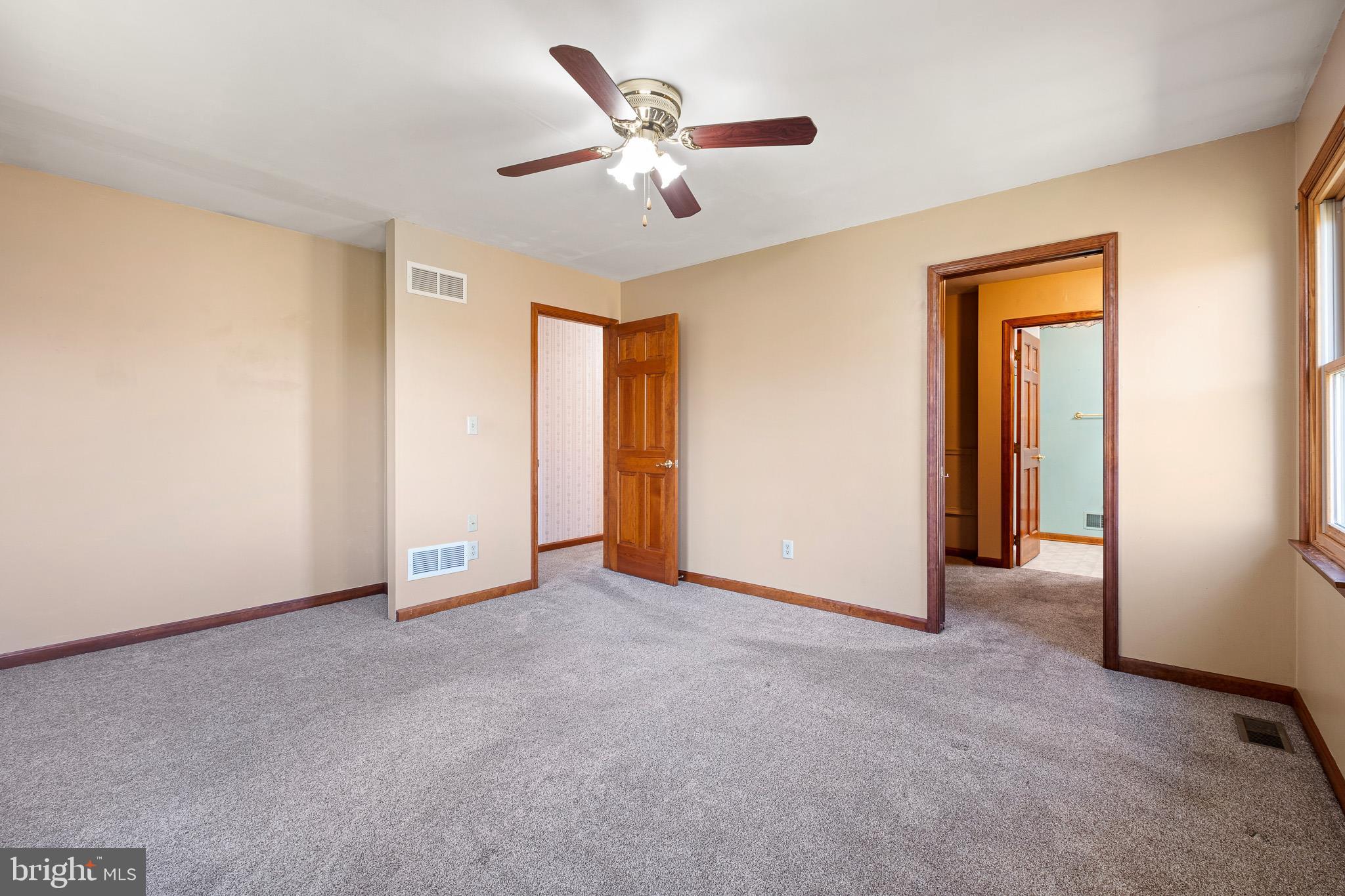 39 Long Drive Elkton, MD 21921 - Photo 27 of 39 a view of an empty room with a ceiling fan