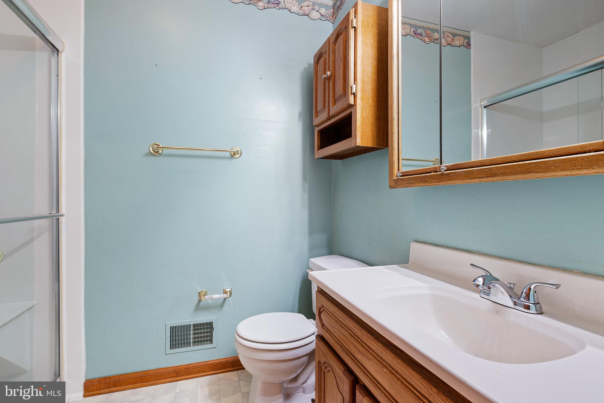 39 Long Drive Elkton, MD 21921 - Photo 29 of 39 a bathroom with a sink a toilet and mirror