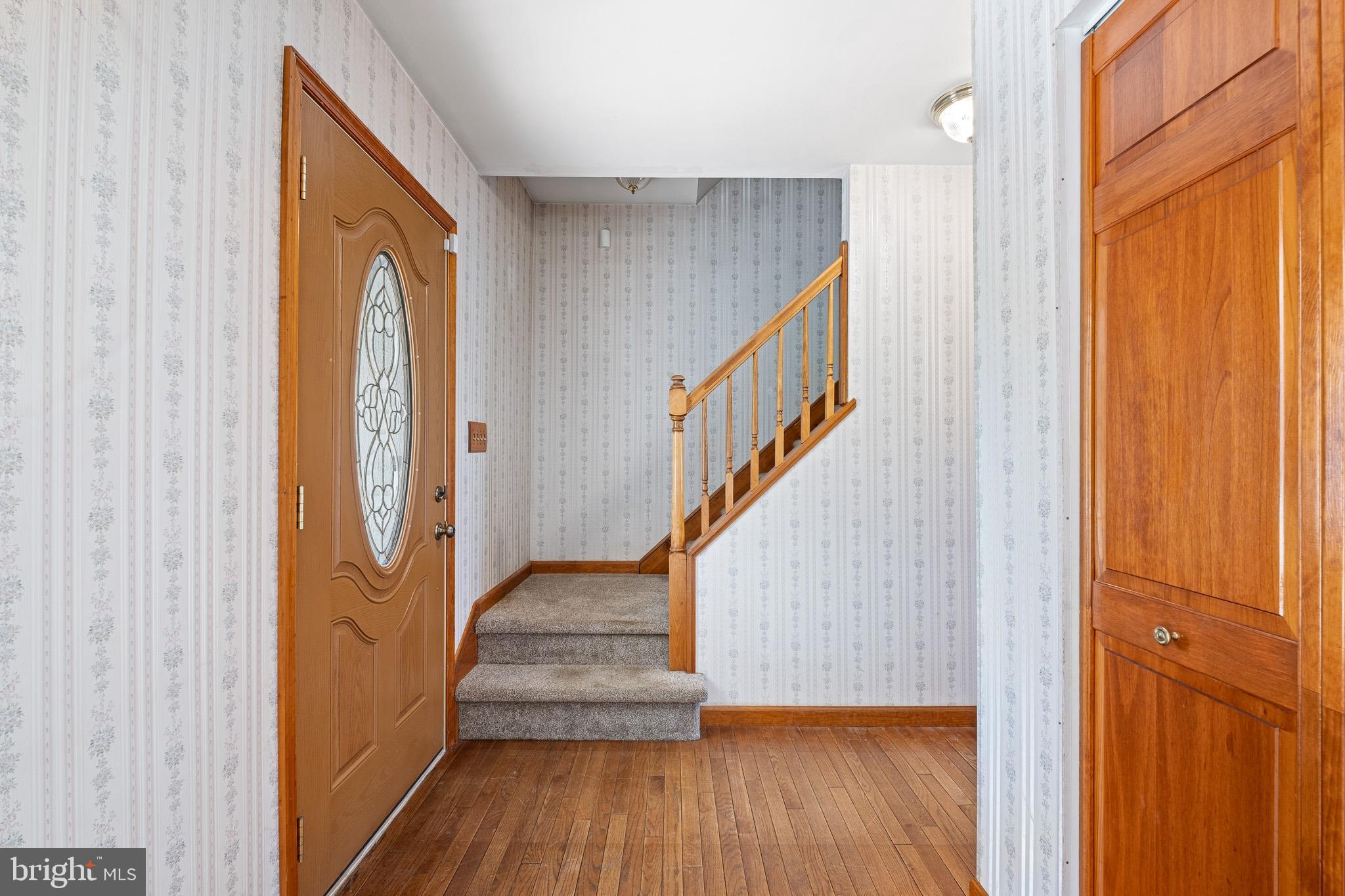 39 Long Drive Elkton, MD 21921 - Photo 8 of 39 a view of a hallway with wooden floor and staircase