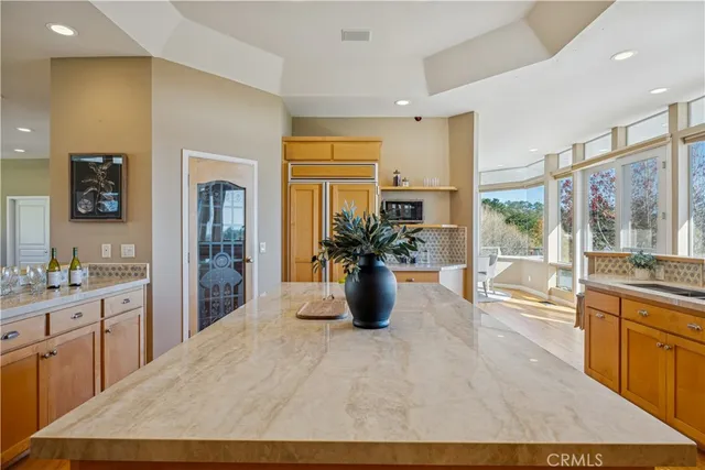 a view of a dining room with furniture wooden floor and chandelier