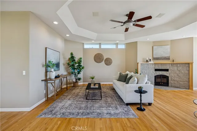 a view of a house with a yard and sitting area