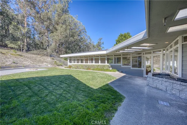 a bathroom with a granite countertop sink a mirror and a shower