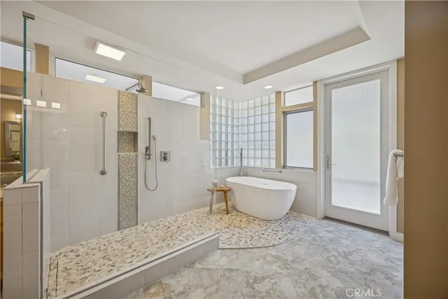 a spacious bedroom with a bed and a window