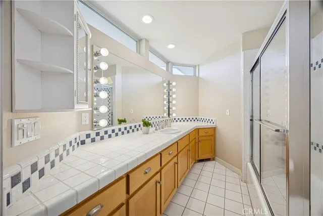 a view of a room with gym equipment and large windows