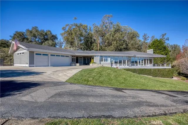 a living room with furniture or outdoor view and a large window