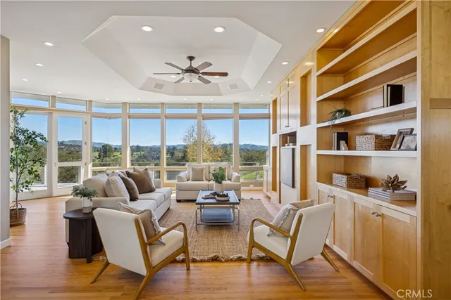 a large kitchen with kitchen island a large window a sink and counter space