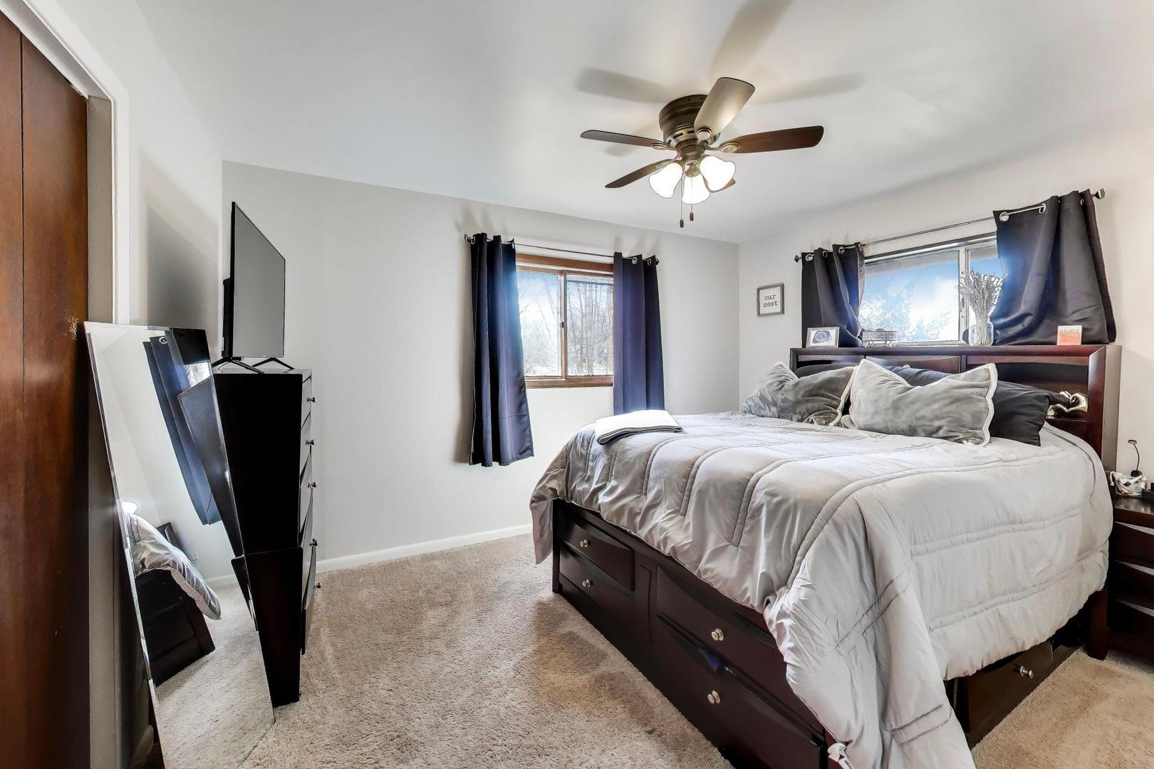 1075 Apricot Street Hoffman Estates, IL 60169 - Photo 13 of 28 a bedroom with bed and window