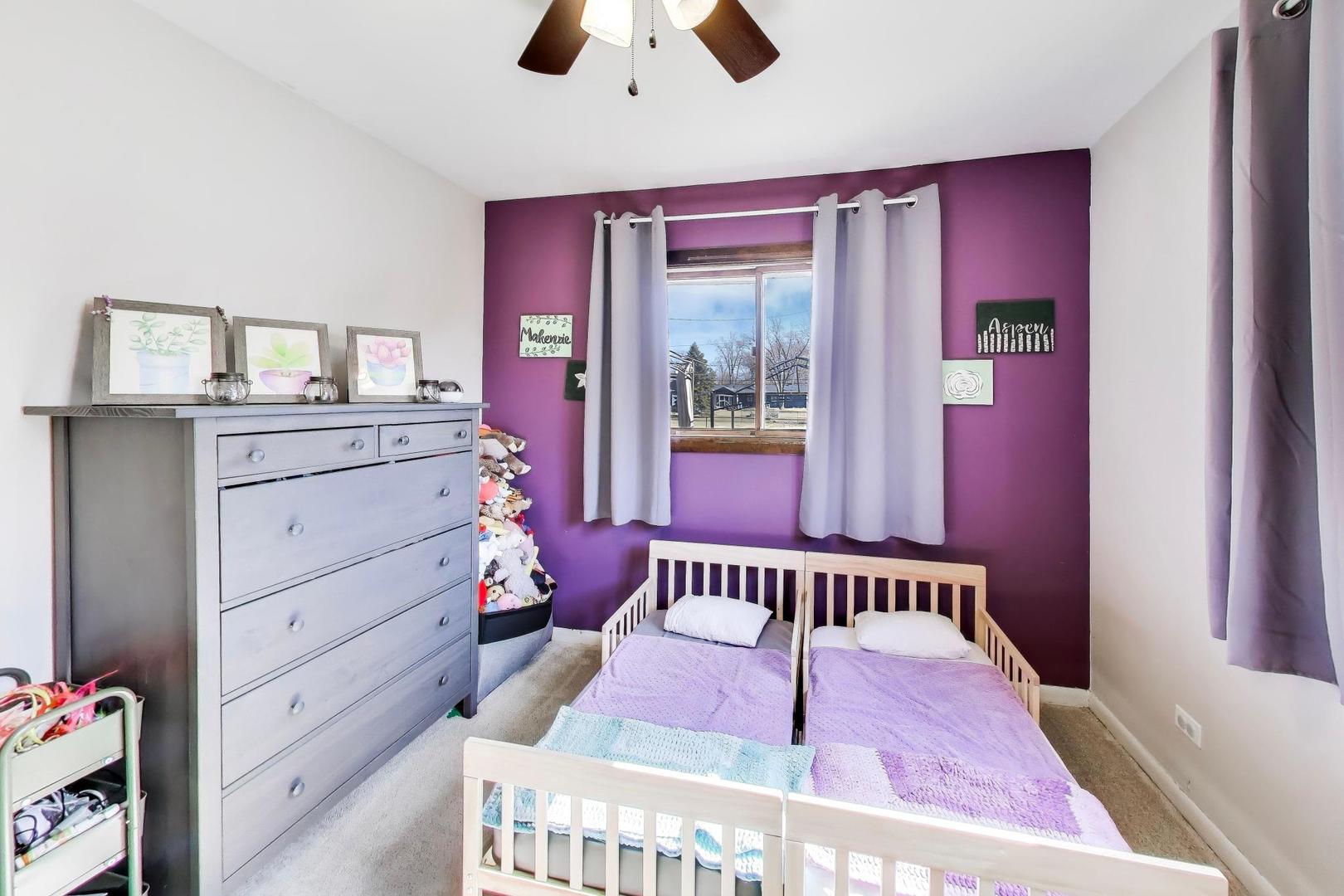 1075 Apricot Street Hoffman Estates, IL 60169 - Photo 14 of 28 a bedroom with a bed and a dresser