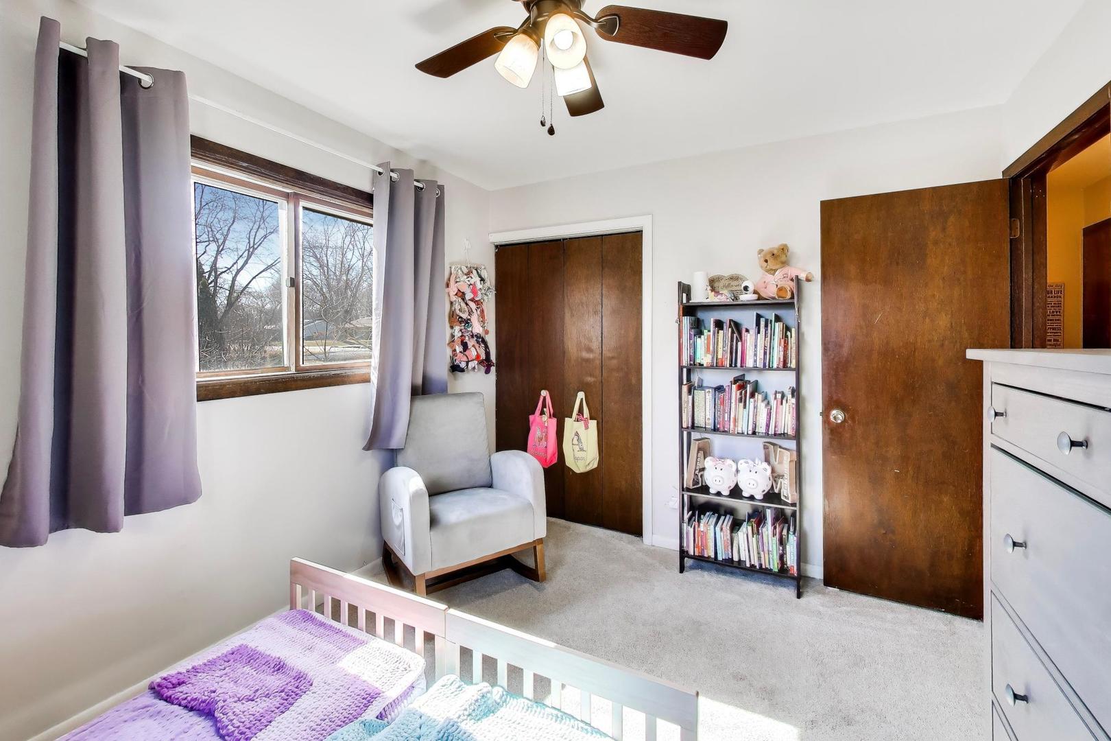 1075 Apricot Street Hoffman Estates, IL 60169 - Photo 15 of 28 a bedroom with furniture and a window