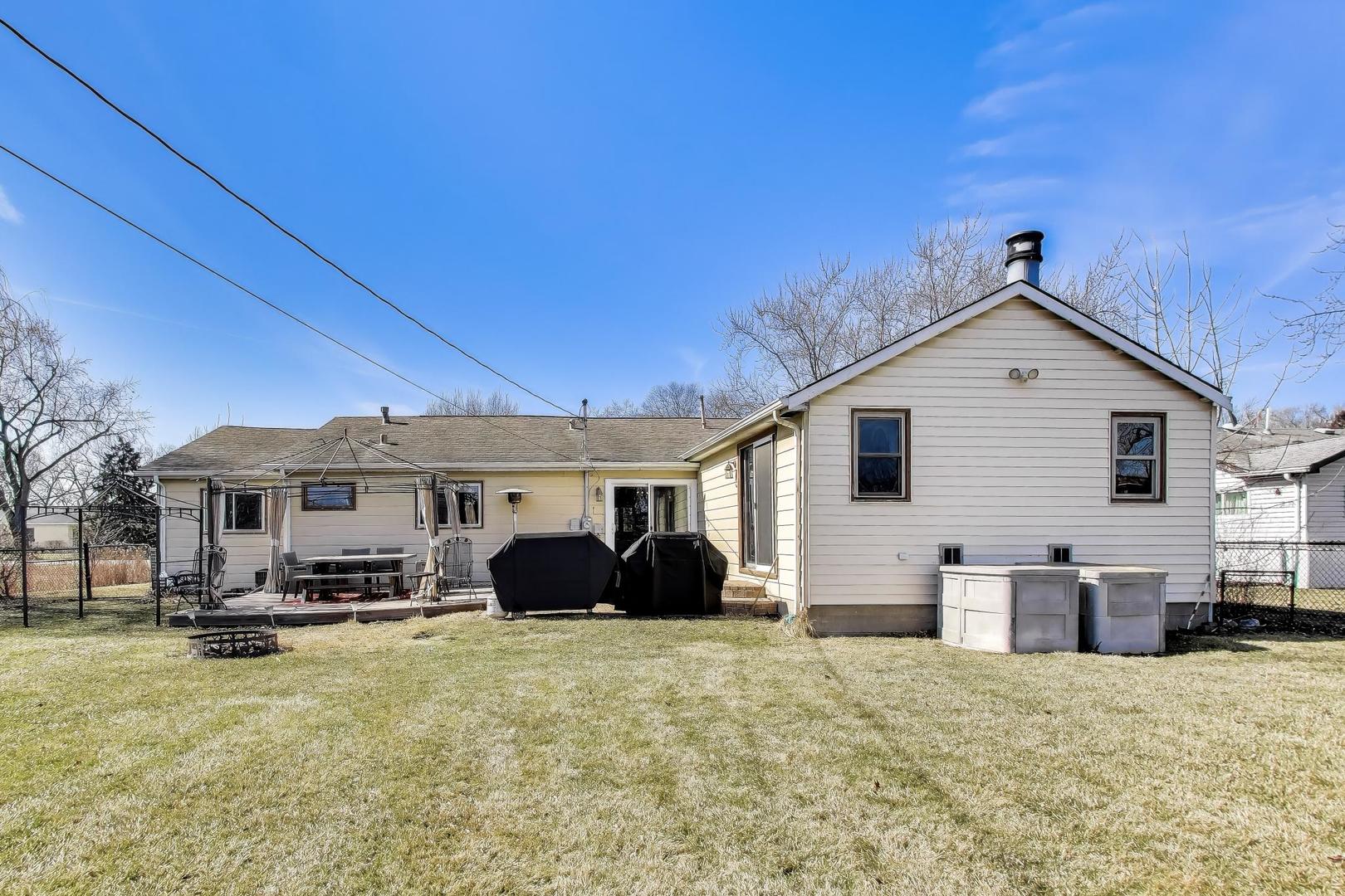 1075 Apricot Street Hoffman Estates, IL 60169 - Photo 17 of 28 a front view of a house with a yard outdoor seating and garage