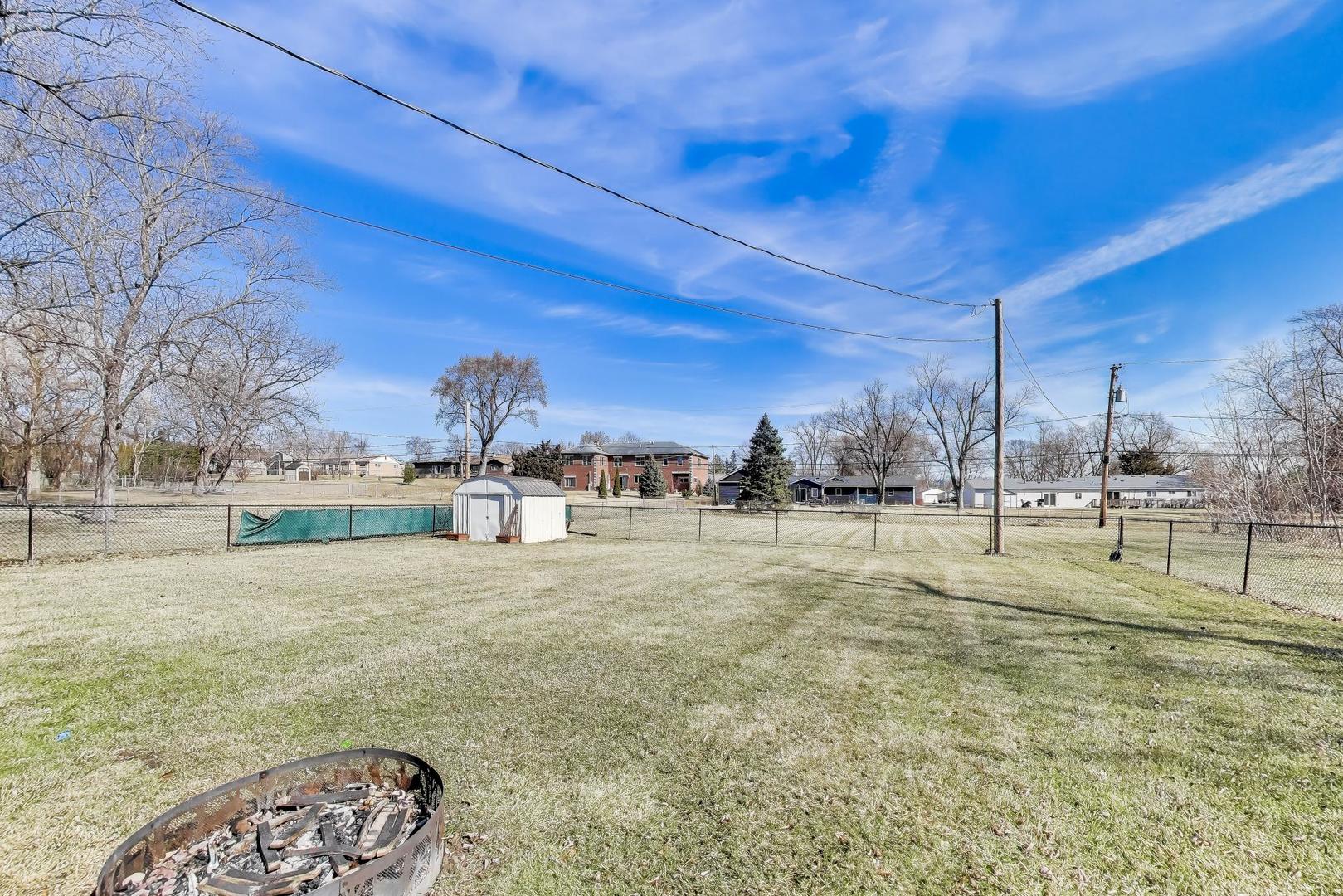 1075 Apricot Street Hoffman Estates, IL 60169 - Photo 22 of 28 a view of a yard with basketball court