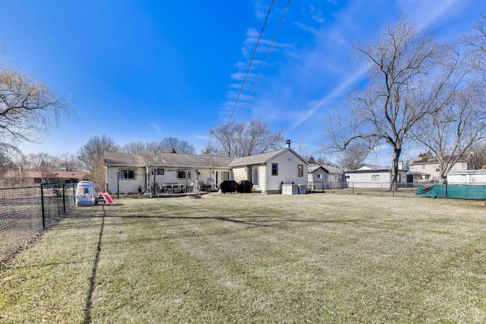 1075 Apricot Street Hoffman Estates, IL 60169 - Photo 23 of 28 a front view of a house with a yard