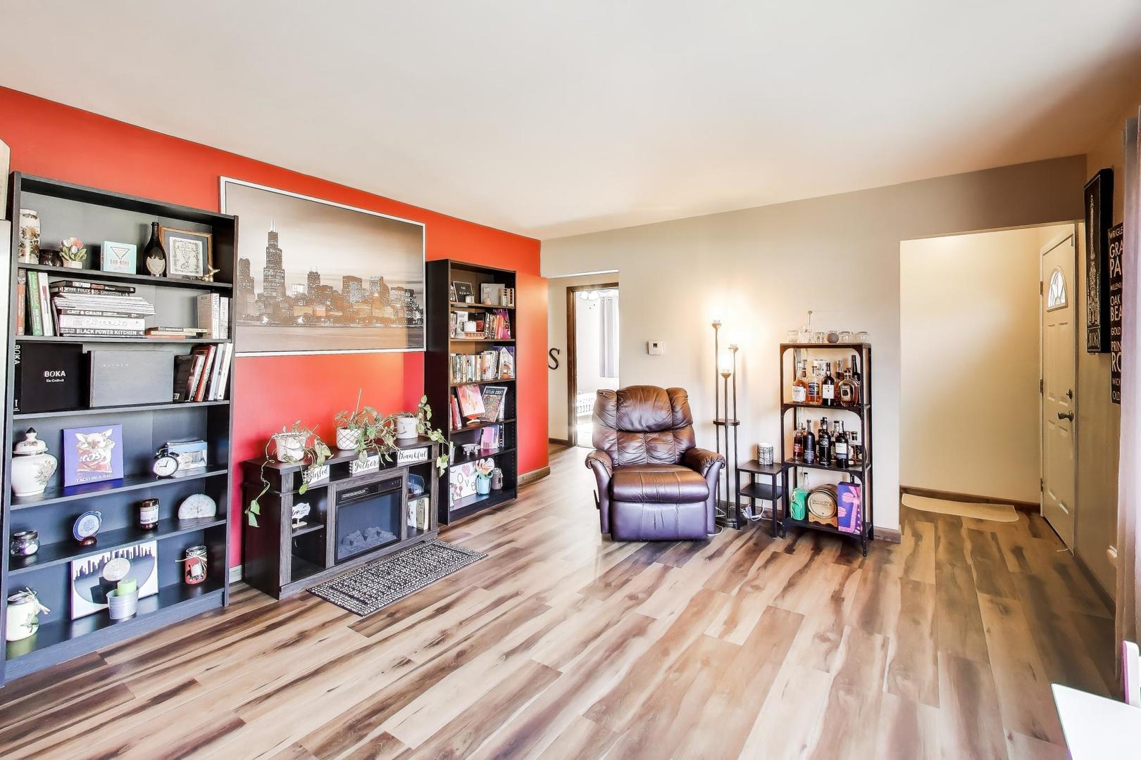 1075 Apricot Street Hoffman Estates, IL 60169 - Photo 3 of 28 a living room filled with furniture and a wooden floor