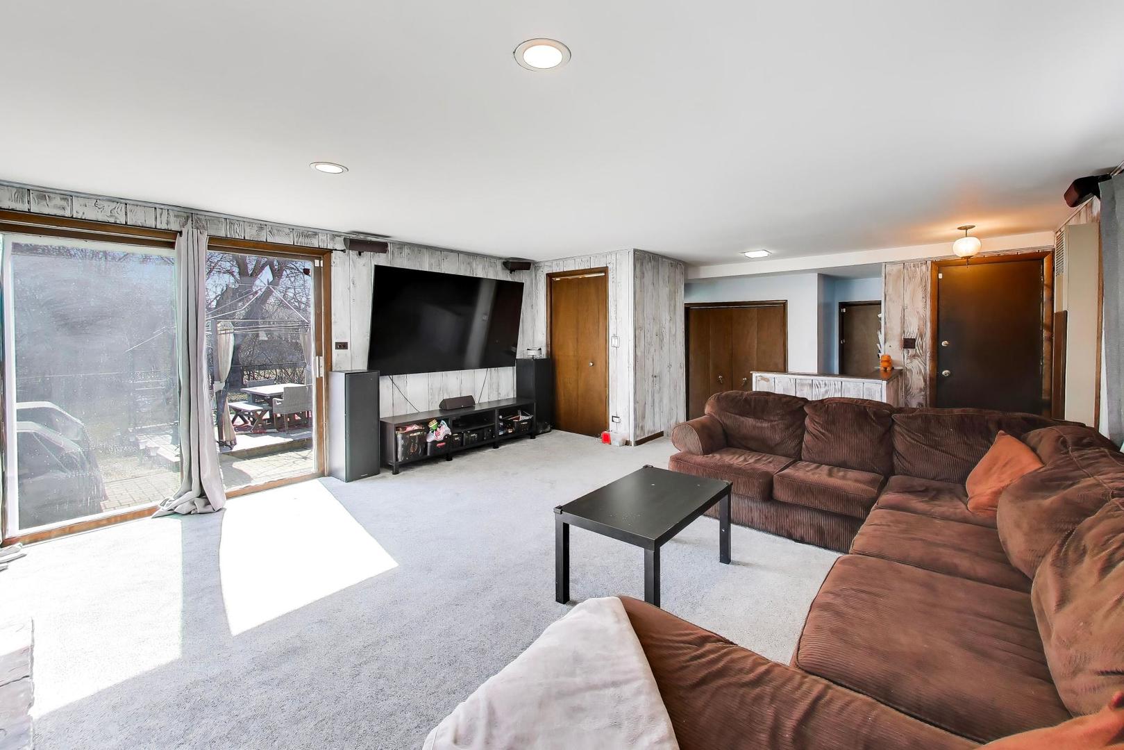 1075 Apricot Street Hoffman Estates, IL 60169 - Photo 9 of 28 a living room with furniture and a flat screen tv