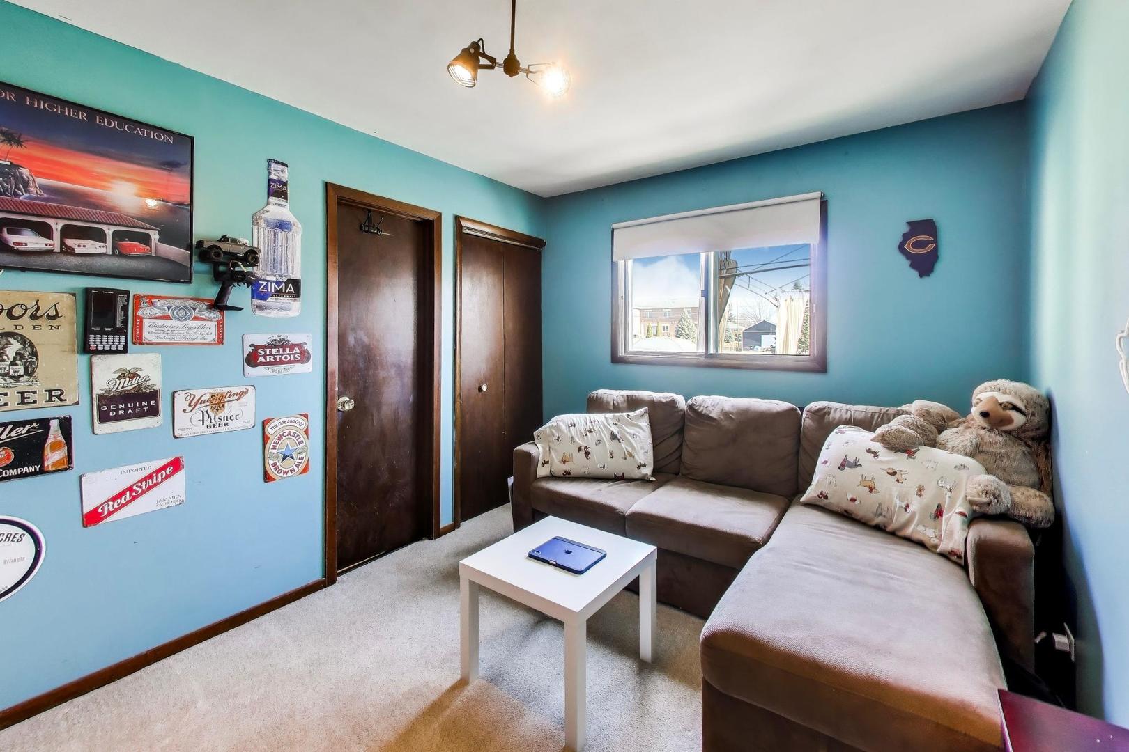 1075 Apricot Street Hoffman Estates, IL 60169 - Photo 10 of 28 a living room with furniture and a flat screen tv