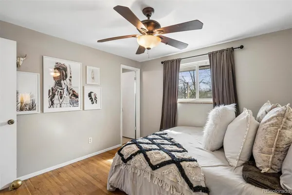 a bedroom with bed and a window