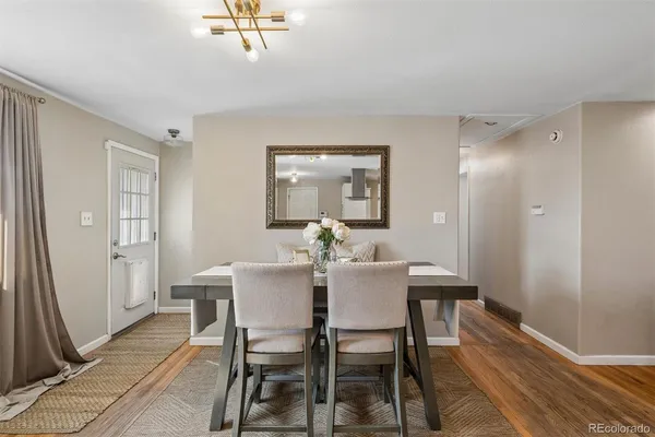 a view of a dining room with furniture and a window