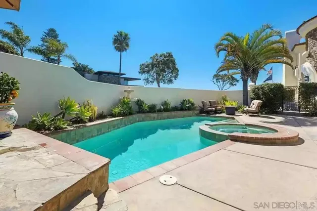 a view of living room kitchen and entryway