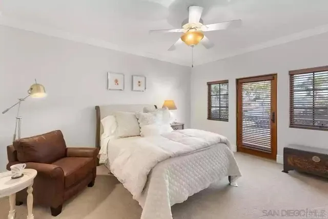 a bathroom with a sink vanity mirror and toilet