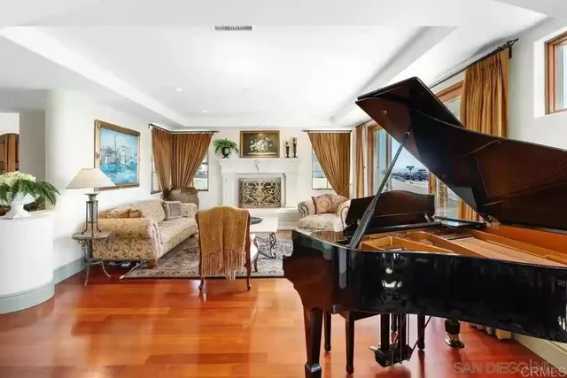 a living room with furniture and a fireplace