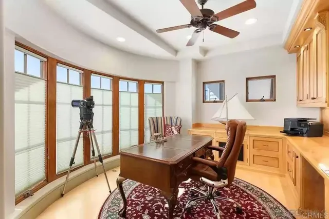 a spacious bathroom with a toilet sink and mirror