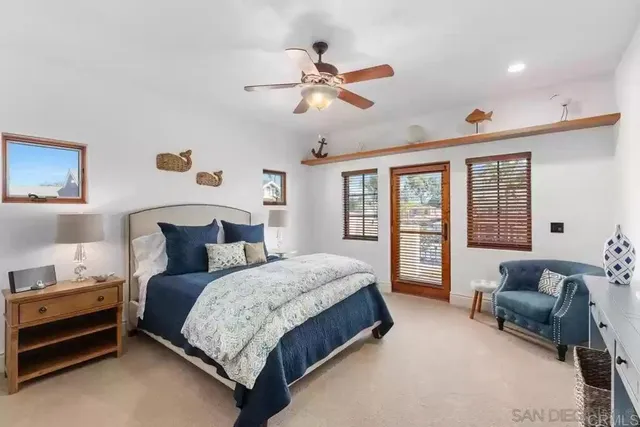 a view of a patio with table and chairs and potted plants
