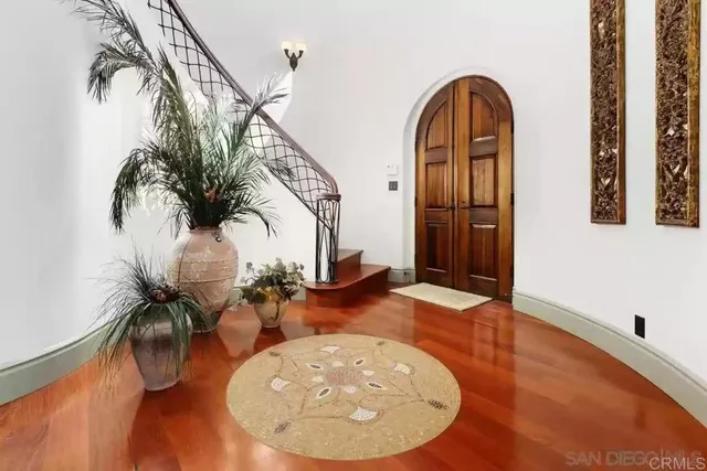 a view of a room with furniture and chandelier